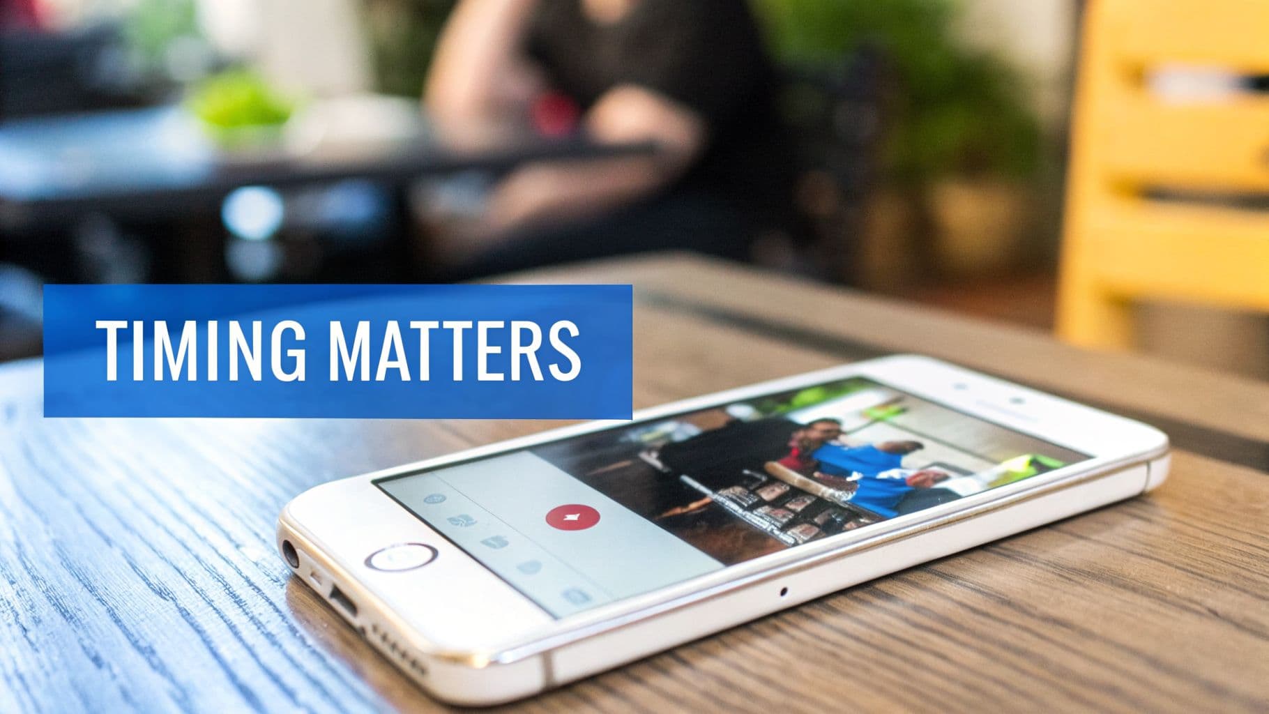 A smartphone on a wooden table displaying a photo, overlaid with a 'TIMING MATTERS' banner.